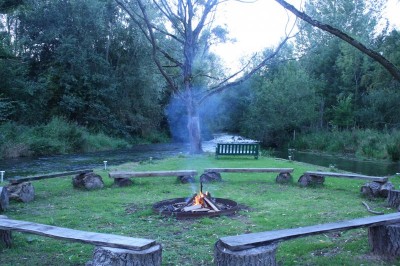 Mill Retreat Centre out side fire meeting place by river convergence